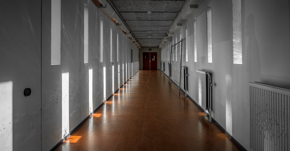 130 years between them - Empty Interior of Passage Between Buildings