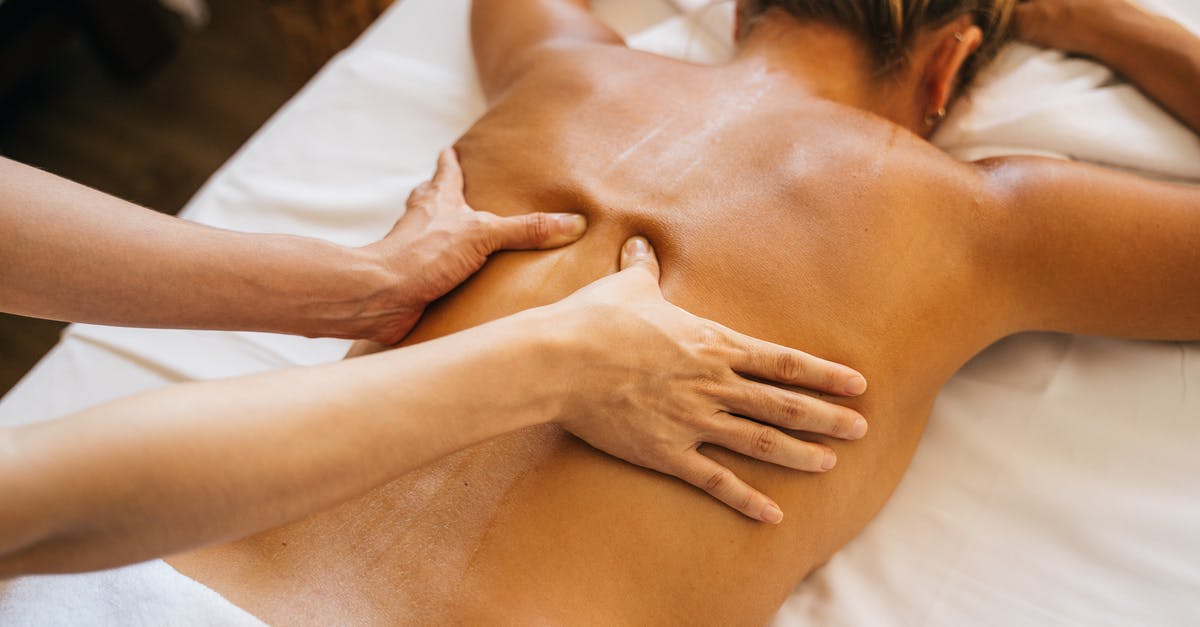 5 go down - 6 come back - who is the sixth? - A Person Massaging a Client's Bare Back