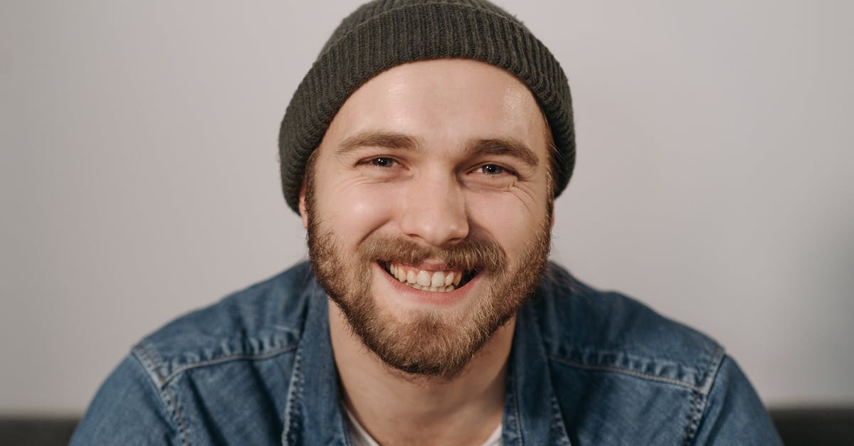A guy hires man to commit suicide-by-assassin, but killer fails, kills other people accidentally? [closed] - Bearded Man Wearing Knit Cap Smiling
