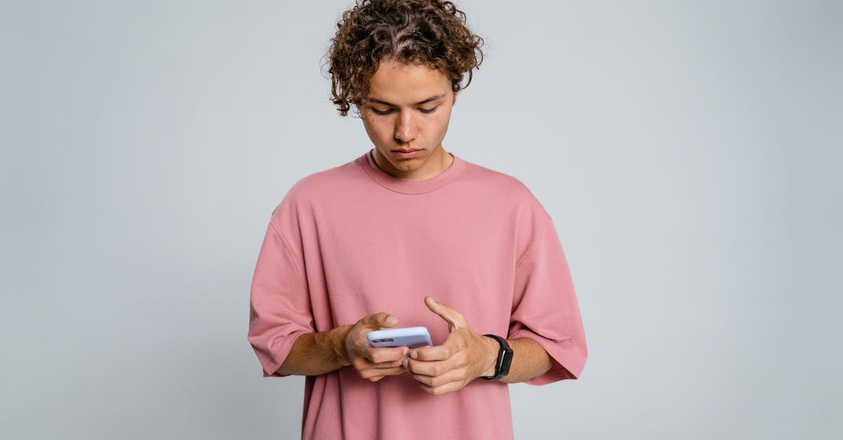 A movie about black activist whos ideas get turned down by racist radio producer only to become racist himself and get tortured and killed [closed] - Woman in Pink Crew Neck Long Sleeve Shirt Holding Black Smartphone