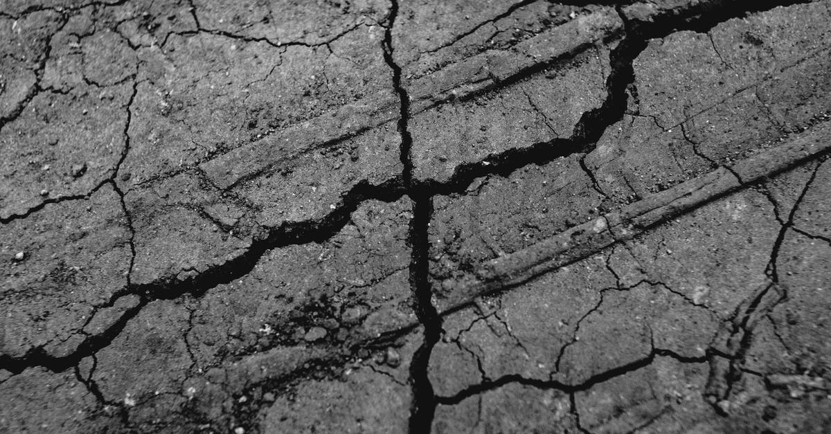 A movie in which aliens attack the Earth and destroy it, and then replace it with a new Earth [closed] - Dry cracked ground in daylight