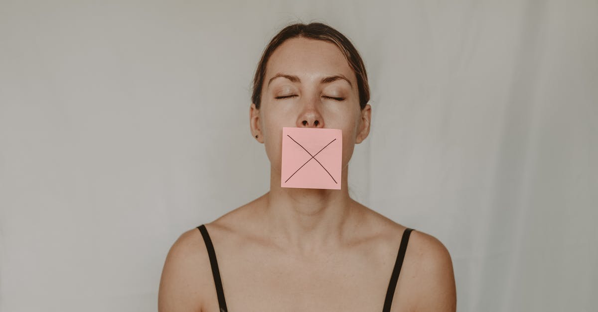 A show about four heroes fighting against evil [closed] - Young slender woman with closed eyes and mouth covered with sticky note showing cross on white background