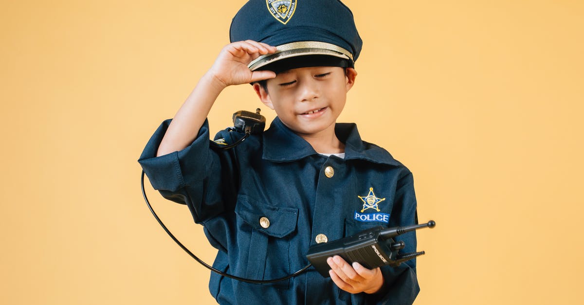 Actual purpose of Neo - Ethnic kid in police uniform in studio