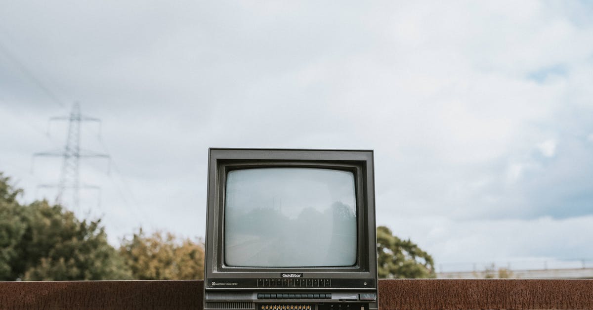 Are fictional trademarks or brand names used in movies and TV legally held? - Retro TV set placed on stone surface