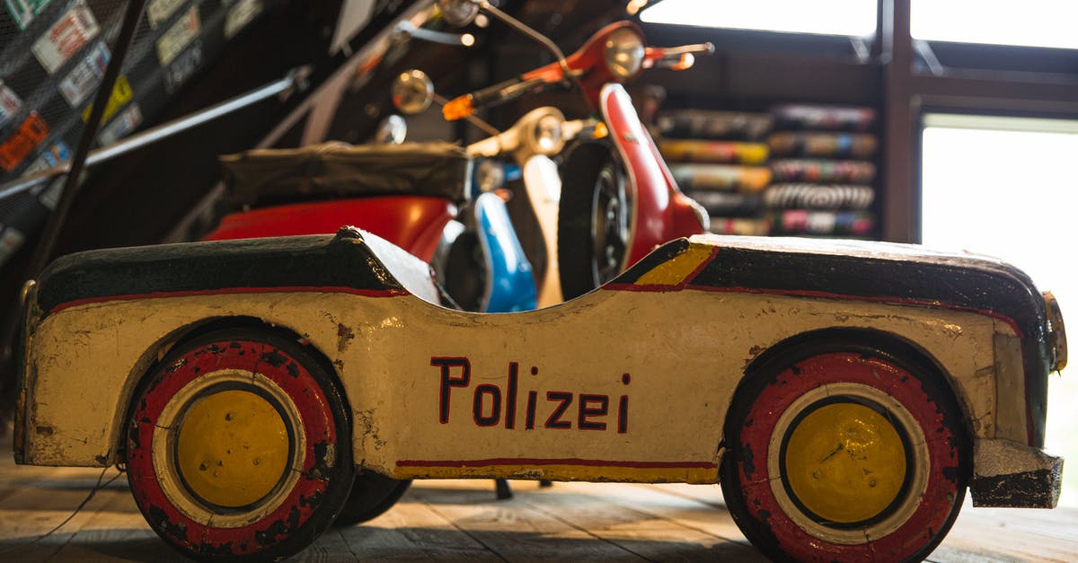 Are Minipods transporting to another game within a game? - Aged toy police car on wooden shelf