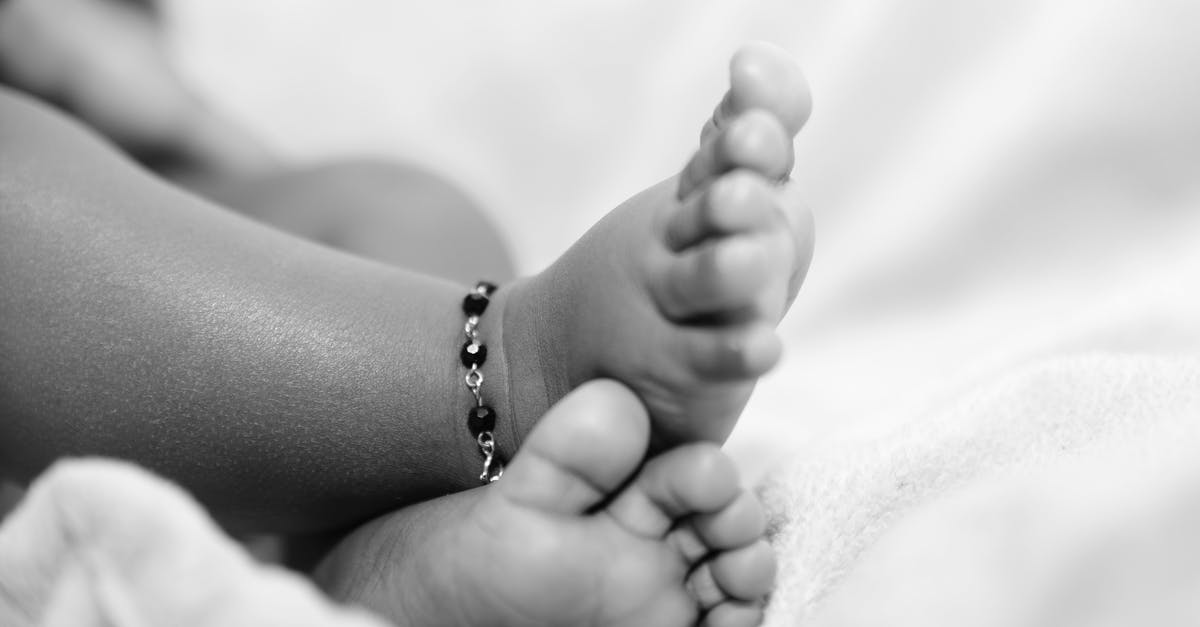 Are newborn babies infected? - Grayscale Photo of Babys Feet