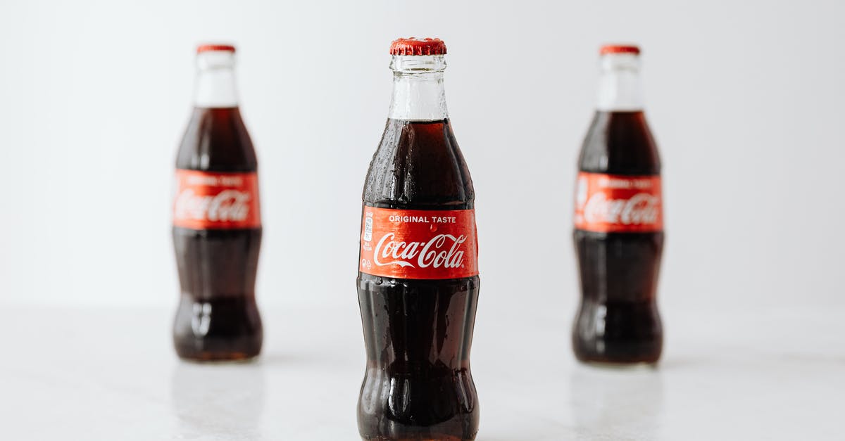 Are scripts seeded to identify leaks? - Modern glass bottles of cold soda with red label placed on white reflective surface