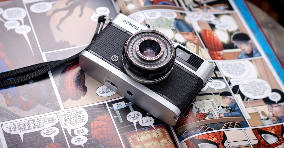 Are the comic strips in the Marvel logo relevant to each film? - From above of opened comics magazine with vintage photo camera placed on top