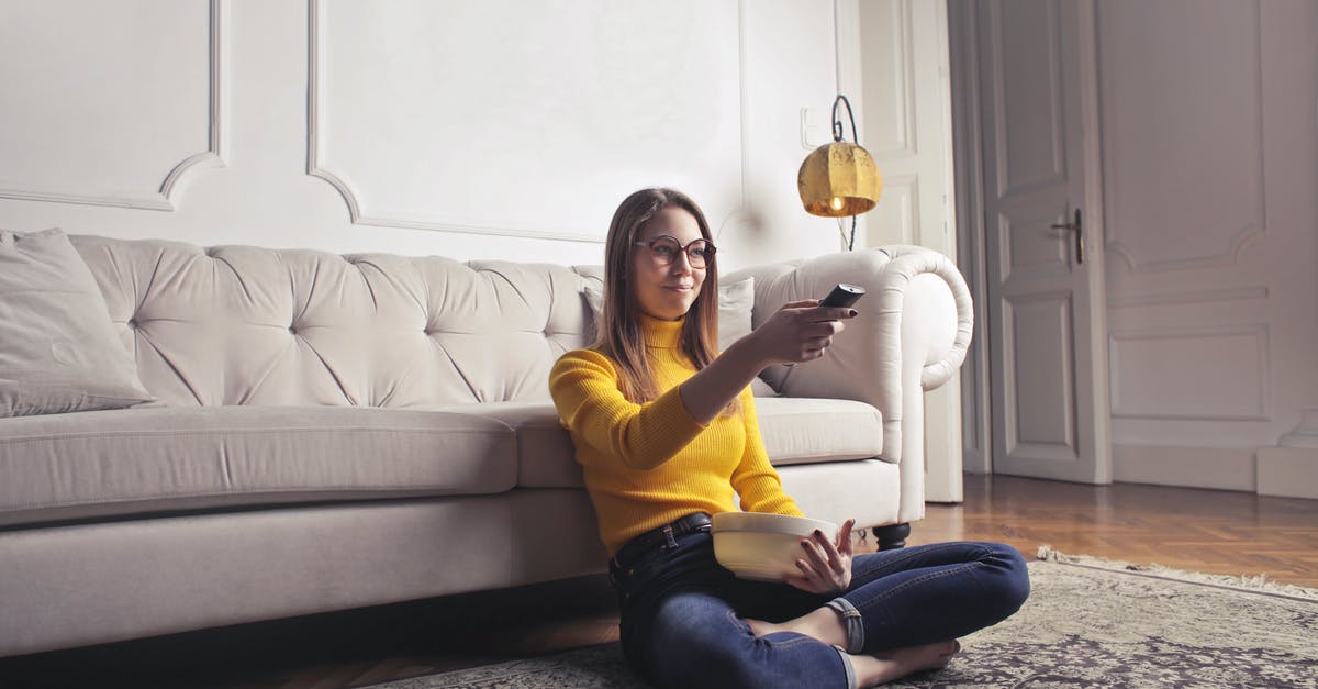 Are the home video releases of the Harry Potter films in the original aspect ratio? - Young woman relaxing at home and watching movie