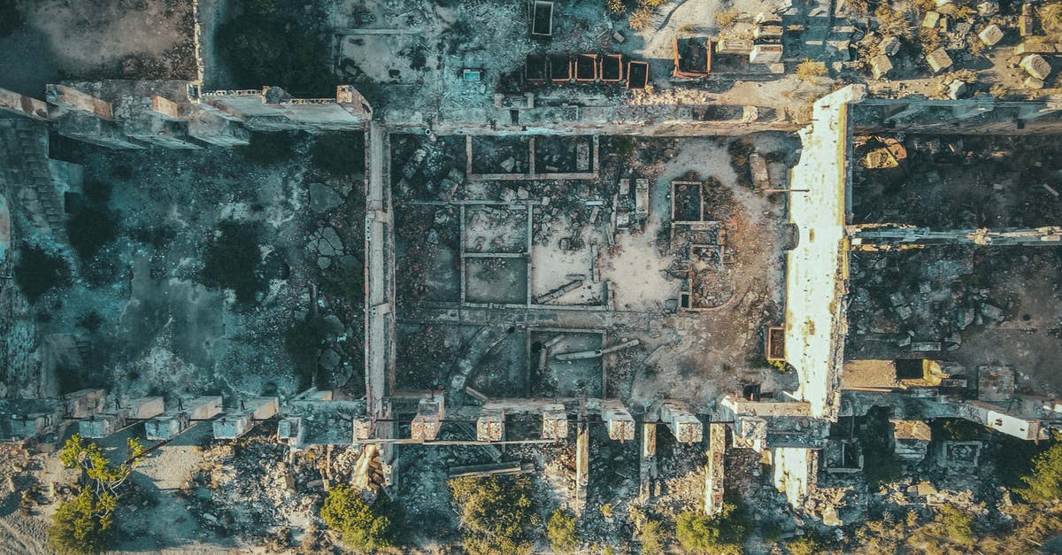 Are the password cracking methods used in the film remotely realistic? - Drone view of ruined stone buildings with damaged walls and roofs located in uninhabited district