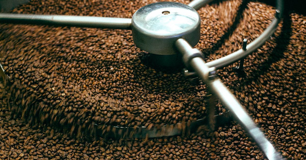 Are there medical equipment product placements in House? - From above of fresh aromatic brown coffee beans mixing in professional roasting machine