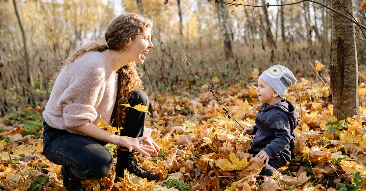 Baby at the end True Detective season 2 - Mother and Son Sitting on Dried Leaves
