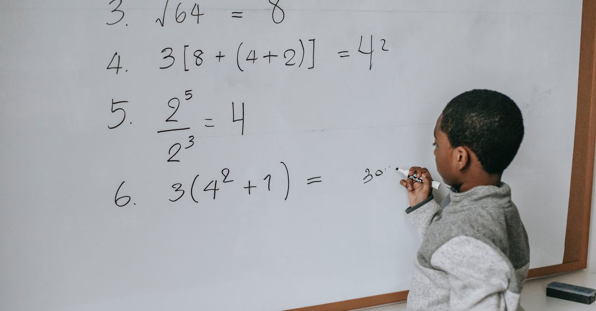 Black Mirror - clever writing or me being cynical - Black schoolboy solving math examples on whiteboard in classroom