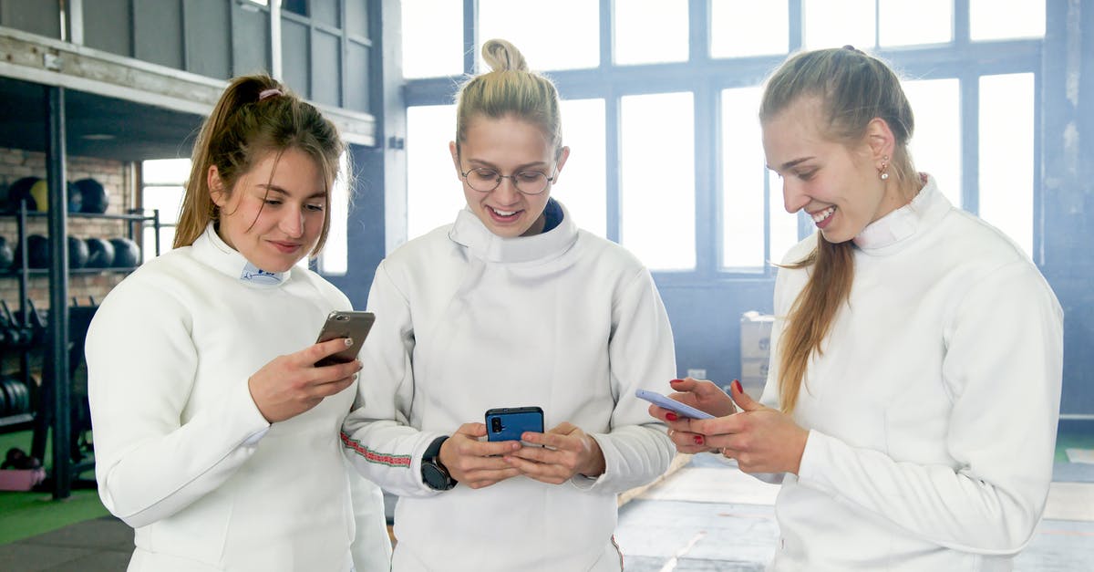 Blocking White Walkers sword attacks. Feasible? - Woman in White Long Sleeve Shirt Holding Blue Smartphone Beside Woman in White Long Sleeve Shirt