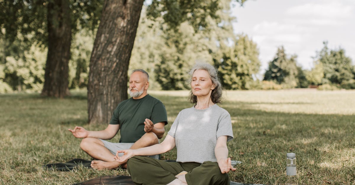 Breathing issues? - An Elderly Couple Meditating in the Park