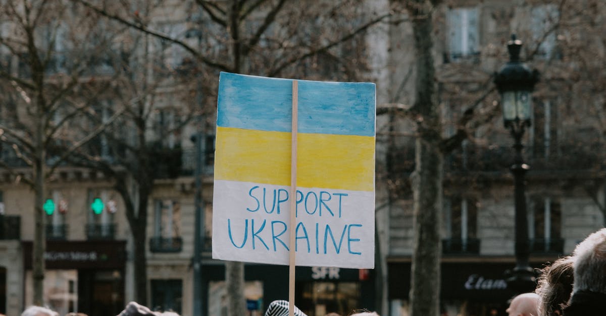 British movie about war crimes [closed] - Large Group of People Holding Banner on Supporting Ukraine