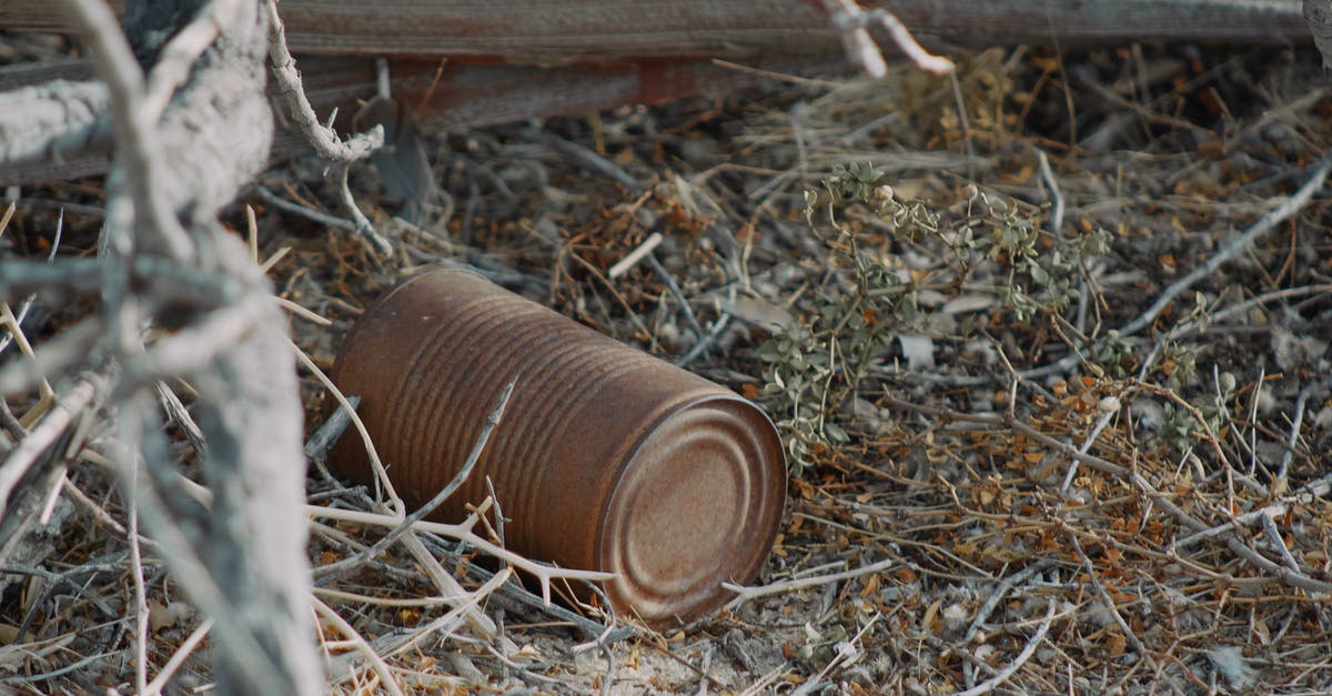 Can anyone make sense of the Cast Away packages that were left on the island? - A Rusty Can on the Dry Grass Ground