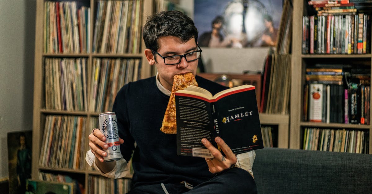 Can Katniss Everdeen read? - A Man Eating Pizza Reading a Book of Hamlet