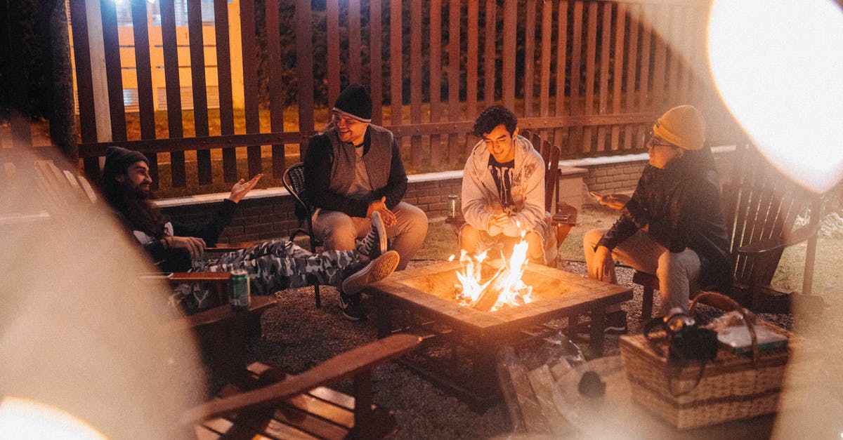 Can Reverse Flash time travel? - Friends talking against burning fire at dusk in campsite