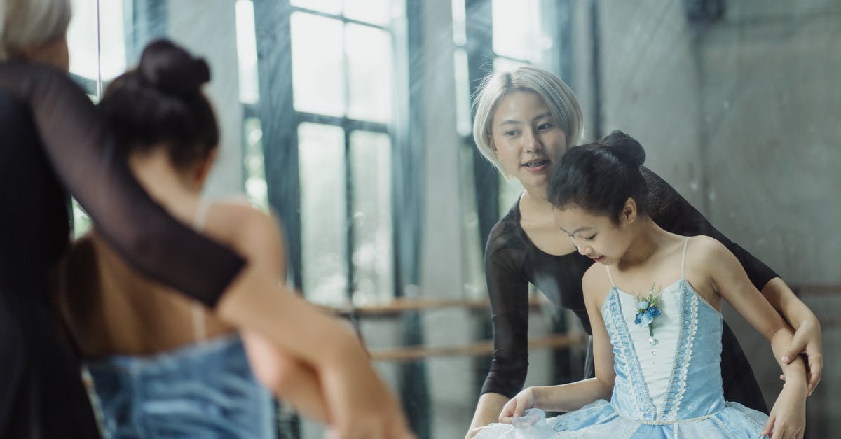 Can someone explain mirror scene with Ariadne in Inception? - Professional ethnic ballerina teaching pupil ballet in dance room of school while looking at reflection in mirror