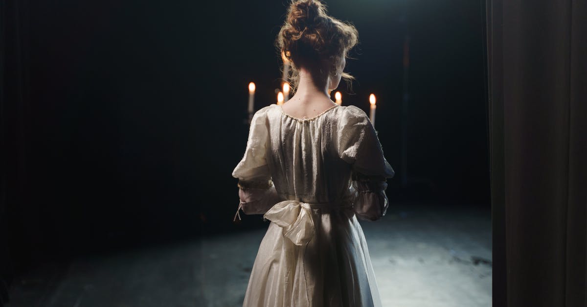 Dance and costume scenes in 'The Act of Killing' - Back View Of A Woman Holding A Candelabrum