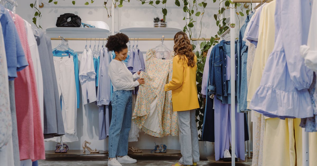 Default choices in "Bandersnatch" - Woman in White Long Sleeve Shirt and Gray Pants Standing Beside Woman in Yellow Long Sleeve