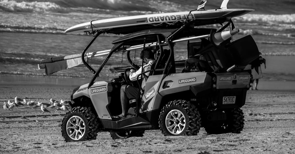Did Hiro rebuild Baymax all by himself? - Grayscale Photo of a Lifeguard on an All Terrain Vehicle