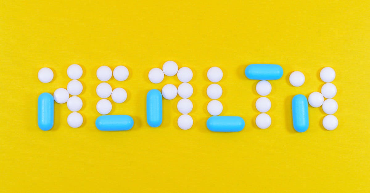 Did the blue pills cause behavioral modification? - White and Blue Health Pill and Tablet Letter Cutout on Yellow Surface