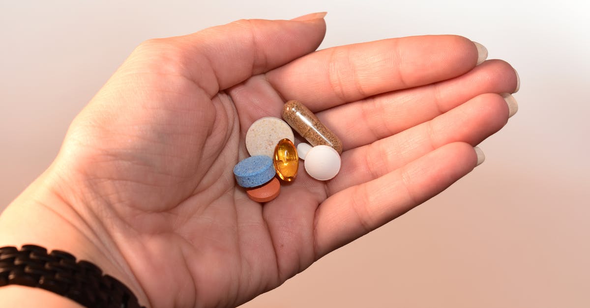 Did the blue pills cause behavioral modification? - Person Holding Medication Pill and Capsules