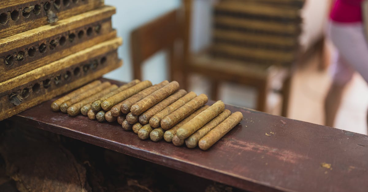 Did the tobacco industry fund MIB 1 and 2? - Production of raw cigars on wooden table in fabric