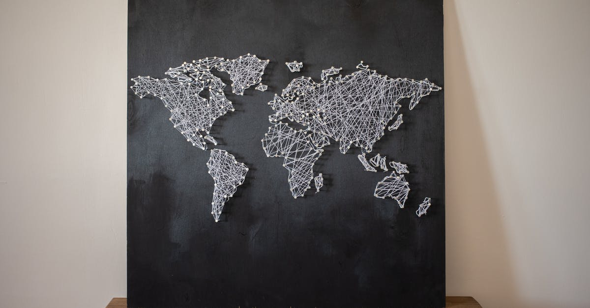 Did the world know about Wakandan Vibranium before the end of Black Panther? - Decorative creative world continents made of threads on black board placed on wooden shelf on white background in light room