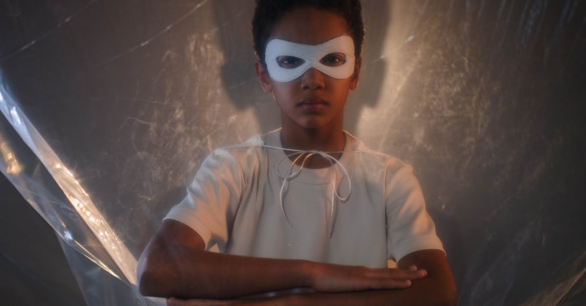 Do all the superheroes in "The Boys" have higher strength and thicker skin? - Boy in White Crew Neck T-shirt Wearing White Eye Mask