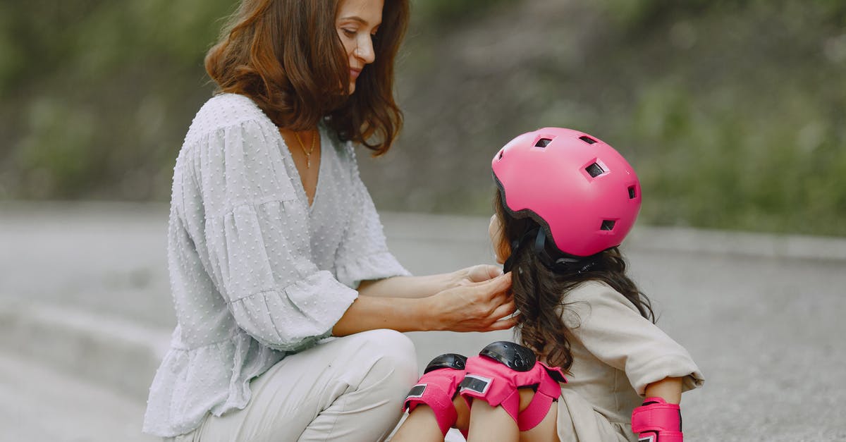 Do child actors also improvise their roles in Curb Your Enthusiasm? - A Woman Helping her Daughter Wear a Helmet