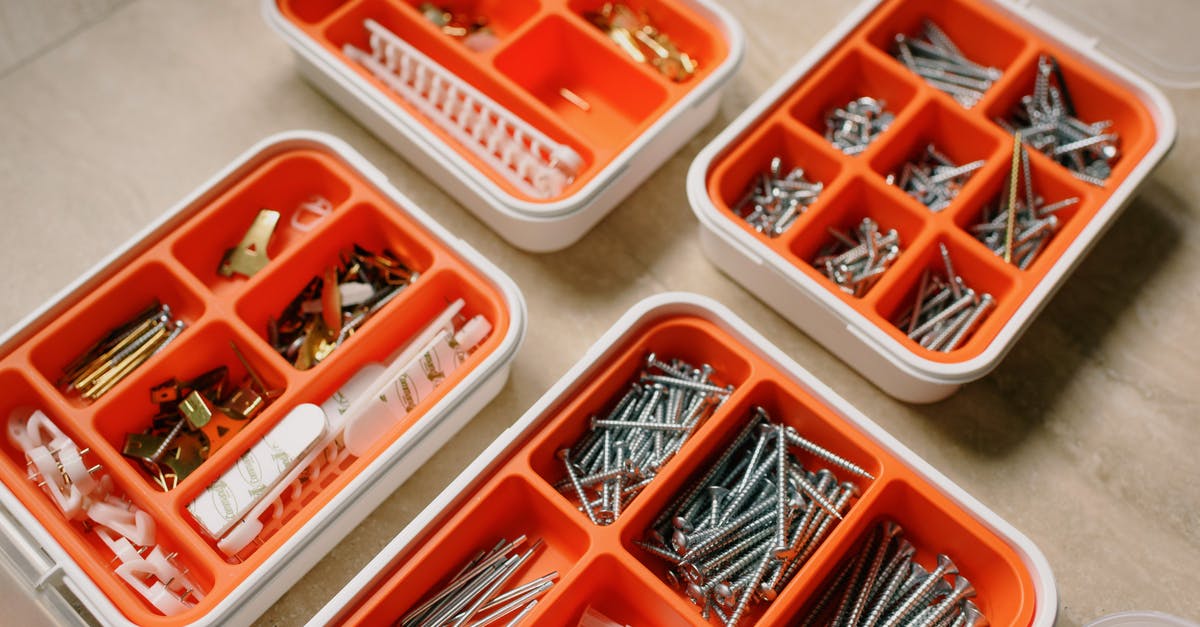 Do different jurisdictions have different specialities? - From above of boxes with different metal nails and plastic dowels in workshop