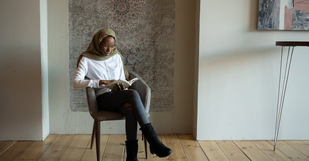 Do I need knowledge of American culture and history to enjoy Forrest Gump? - Focused black Muslim woman reading book on chair