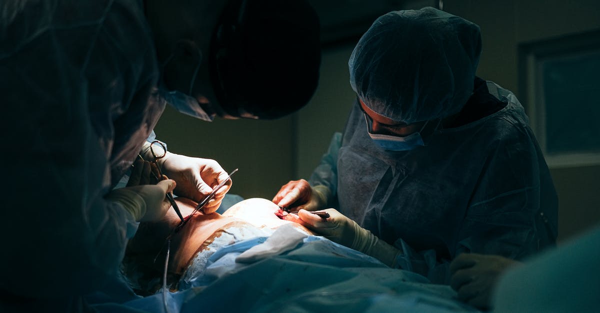 Do patients experience tastes during brain surgery? - Woman in Blue Scrub Suit Lying on Bed