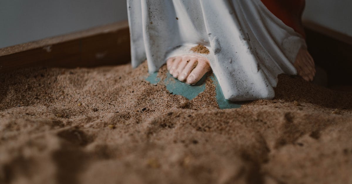 Do rocket scientists believe in fate? [closed] - Jesus Christ Figurine on a Sand