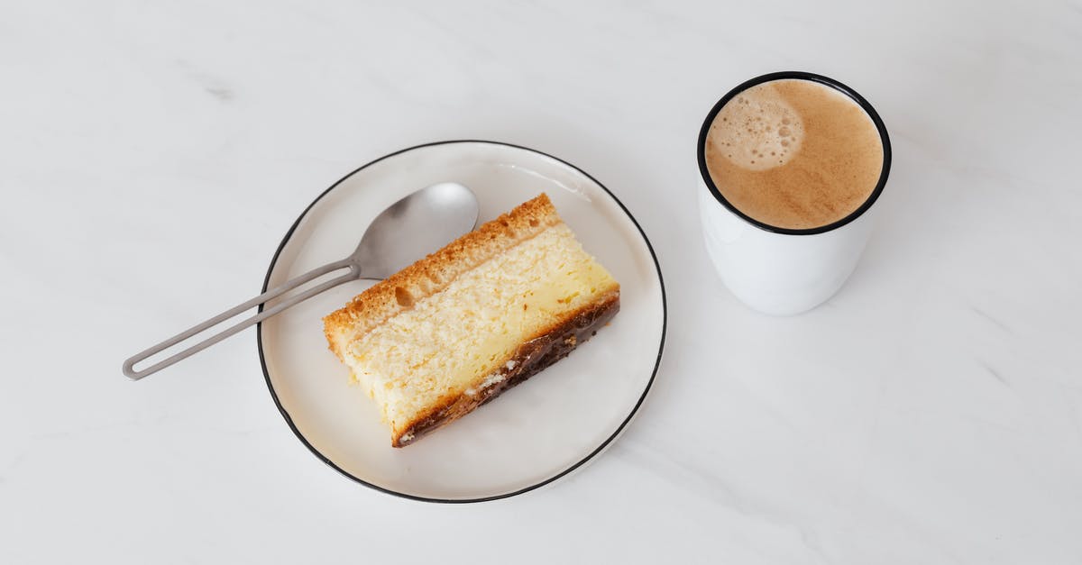 Do they really drink or eat when shooting movies? - From above of cup of hot coffee near white plate with delicious piece of cake placed on white marble tabletop