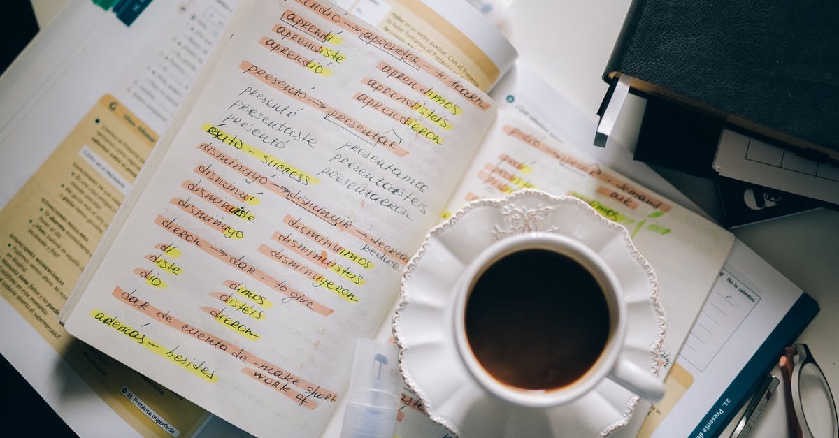 Do translators get a list of jokes and/or puns when making their translations? - A Cup of Black Coffee on a Notebook with Notes of Foreign Language with Translation