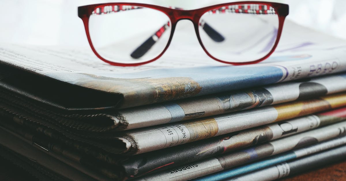 Do TV news-readers ever read news about themselves? [closed] - Red Framed Eyeglasses On Newspapers