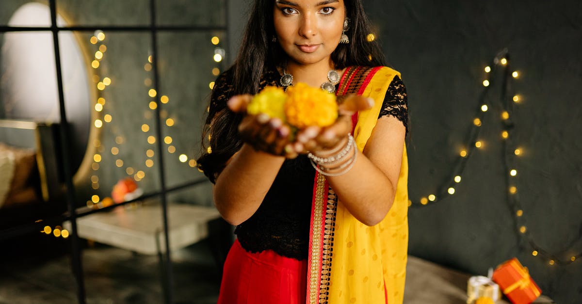 Do Wonder Woman's bracelets have special powers? - Woman in Sari Offering Yellow Flowers