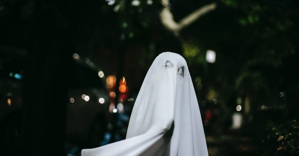 Do you know the name of this ghost town movie? [closed] - Faceless child in ghost costume on Halloween night in town