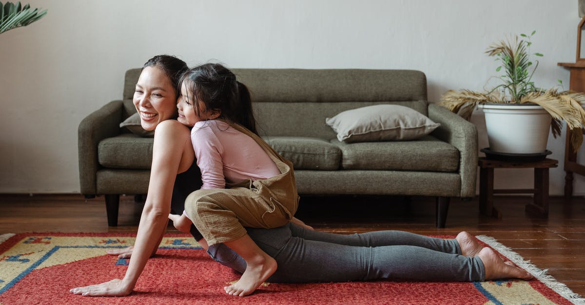 Does #1 have any former training? - Photo of Girl Hugging Her Mom While Doing Yoga Pose
