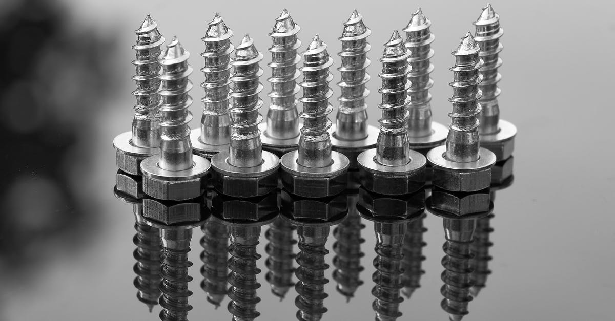 Does 35 to 70 mm blow up lose a part of the image? - Selective Focus Photography of Silver Screws