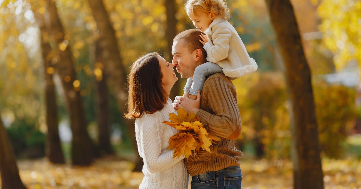 Does Beth leave or stay with the family? - Happy family hugging in autumn park