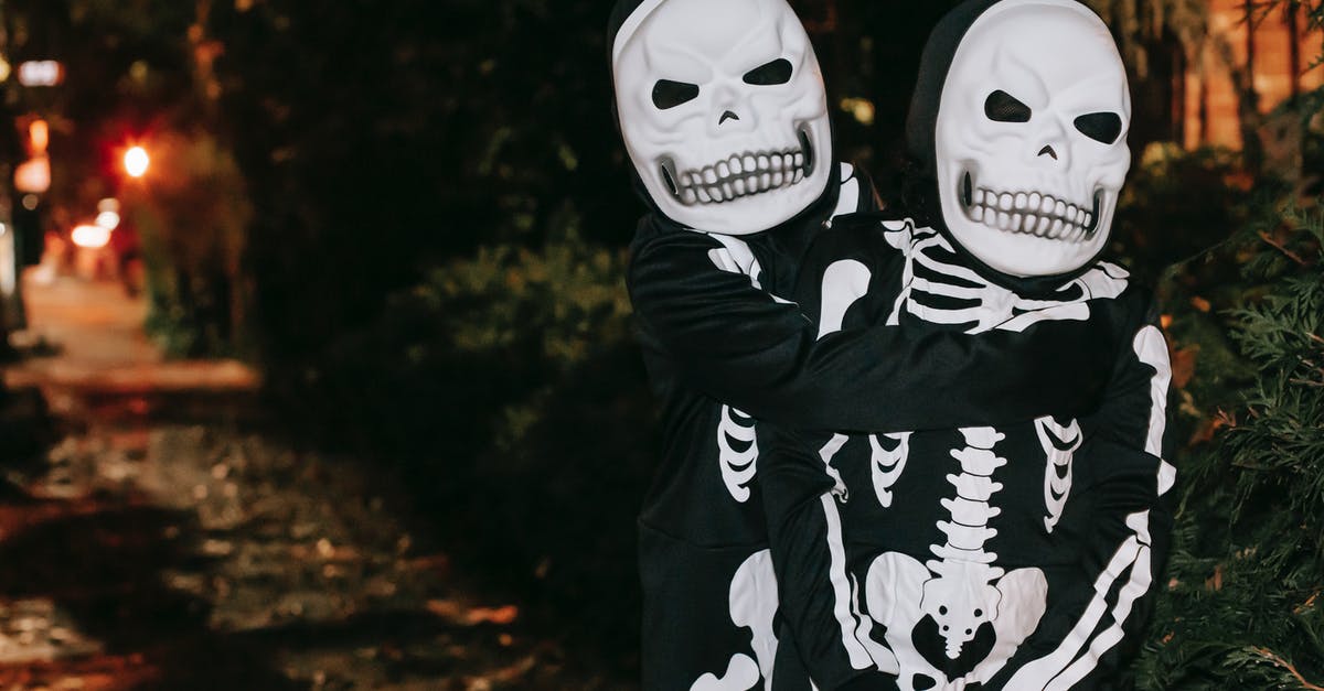 Does Dark have an ending? - Unrecognizable children in skeleton costumes hugging on street