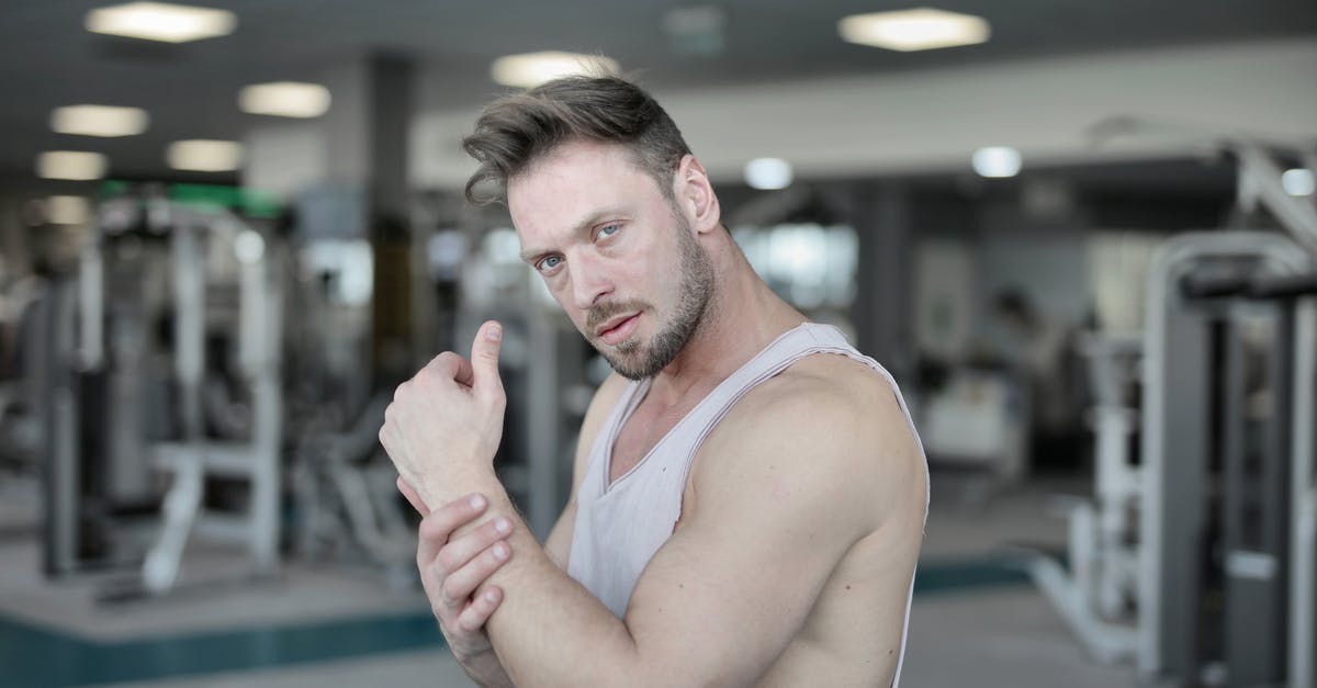 Does Starling City have active subway or not? - Serious male athlete standing in gym and looking at camera