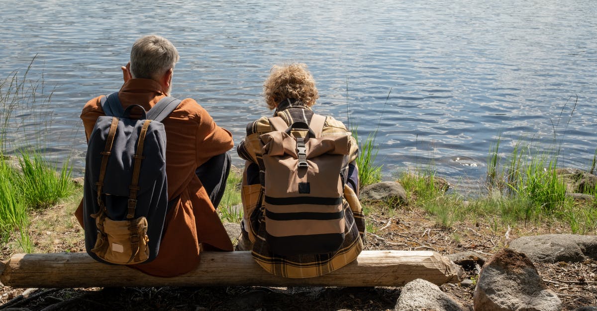 Does Thanos have any inherent superpowers without the Infinity Stones - Grandfather and Grandson Sitting on a Fallen Trunk by the Lake
