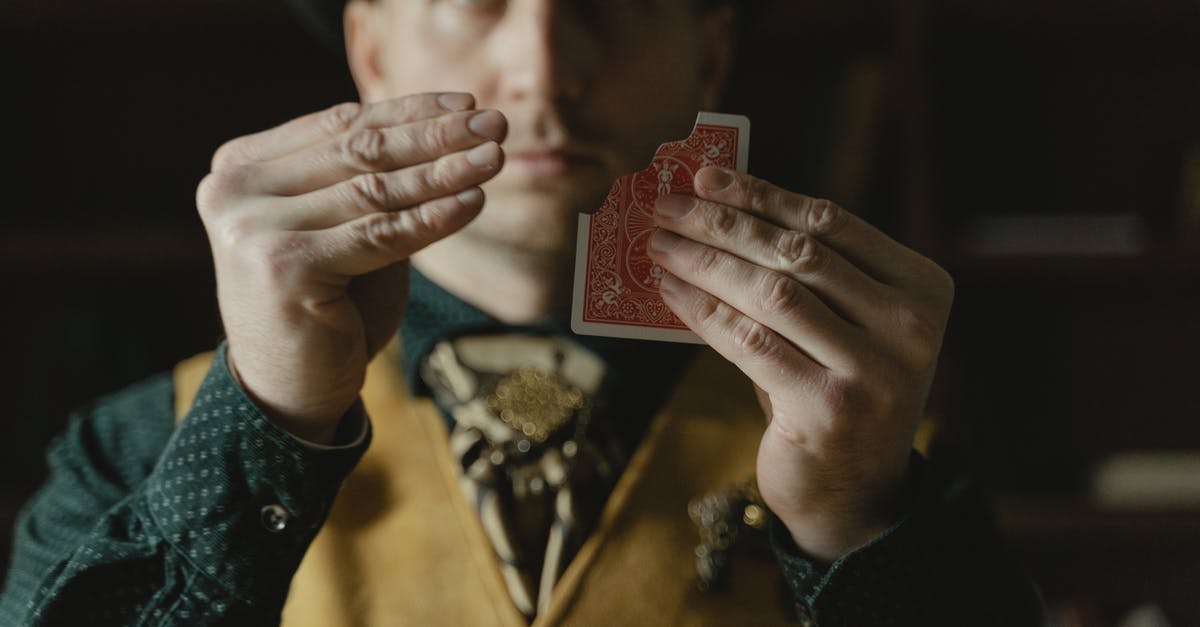 Does the producer demand to have the trick explained before hand, privately? - Photo of a Man Doing a Card Magic Trick