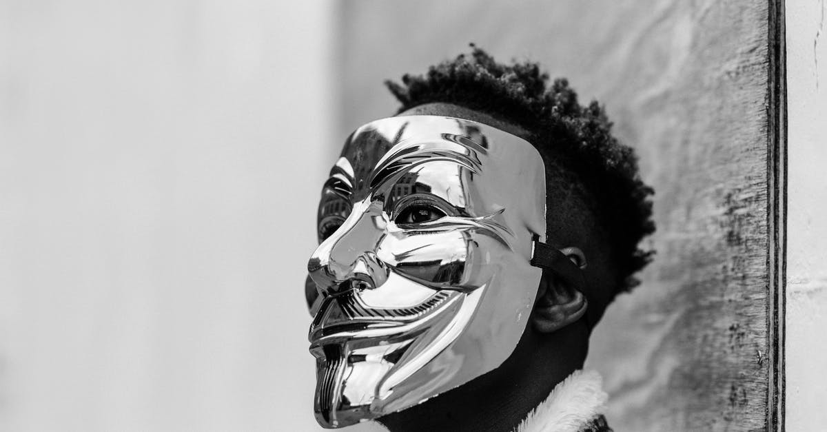 Does time stop when the fourth wall is broken? - Black activist wearing Anonymous mask as sign of protest
